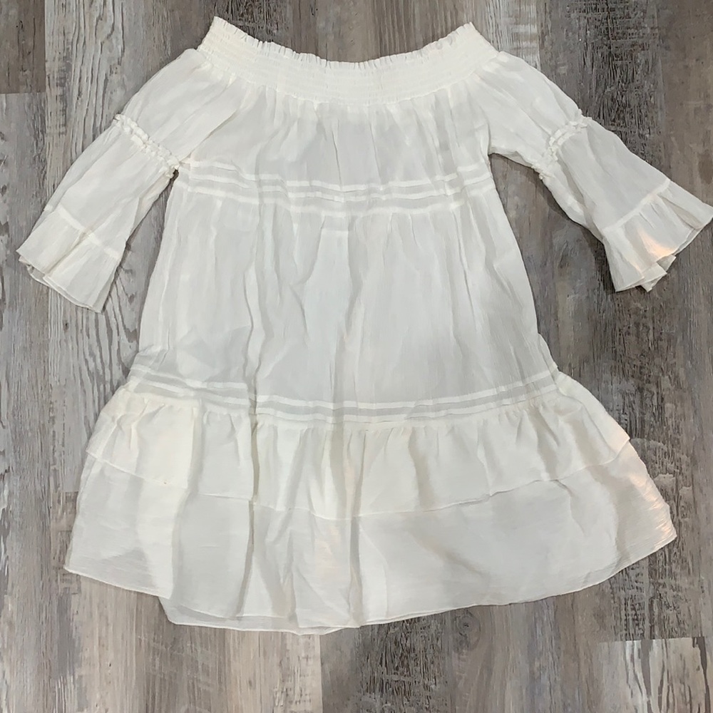 Either a cover up or an off the shoulder dress